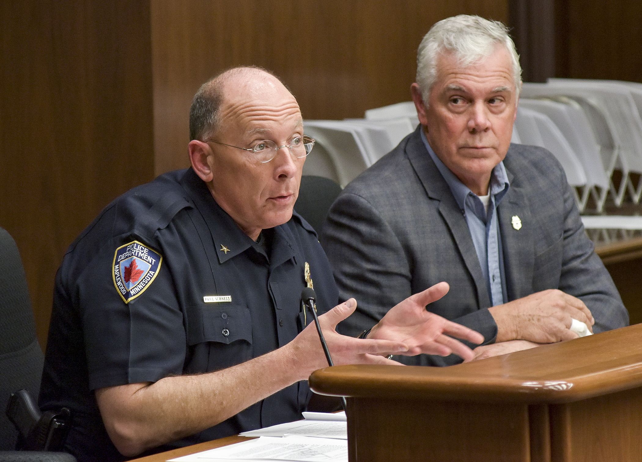 Maplewood Police Chief Paul Schnell, left, testifies before the House Civil Law and Data Practices Committee May 10 in support of a bill sponsored by Rep. Tony Cornish, right, that would classify portable recording system data and establish requirements for its destruction. Photo by Andrew VonBank
